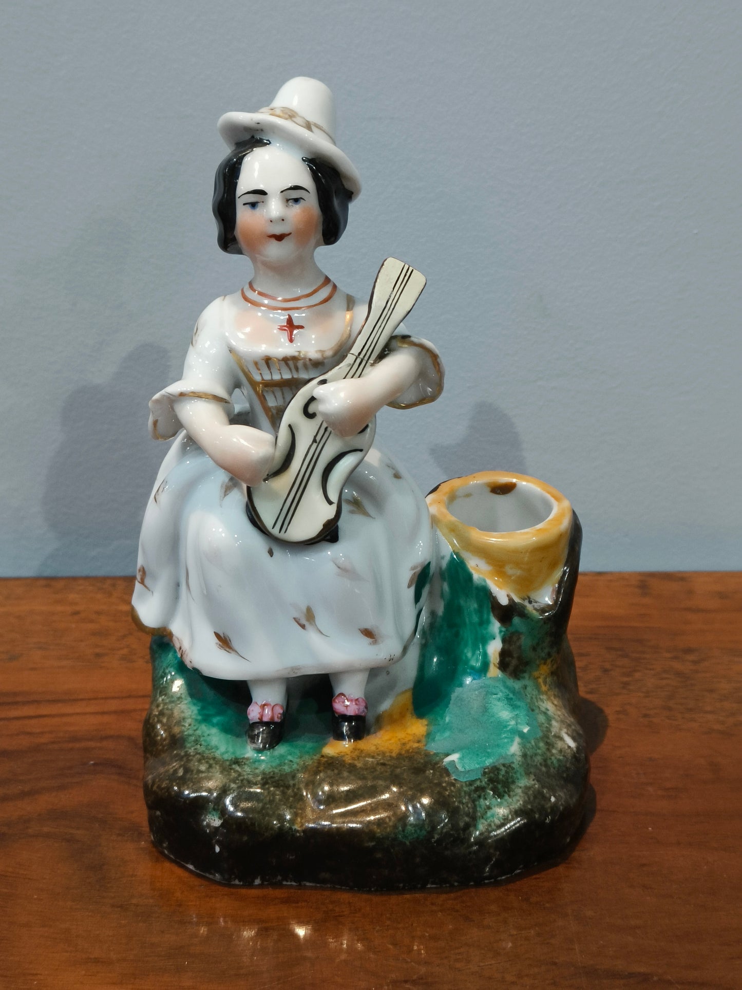 Porcelain figurine of a musician