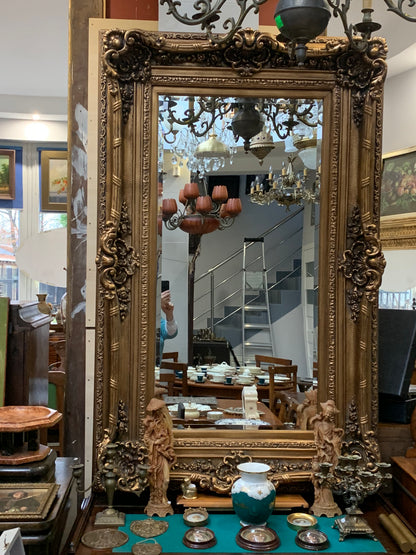 Large baroque mirror, beveled, gilded wooden frame