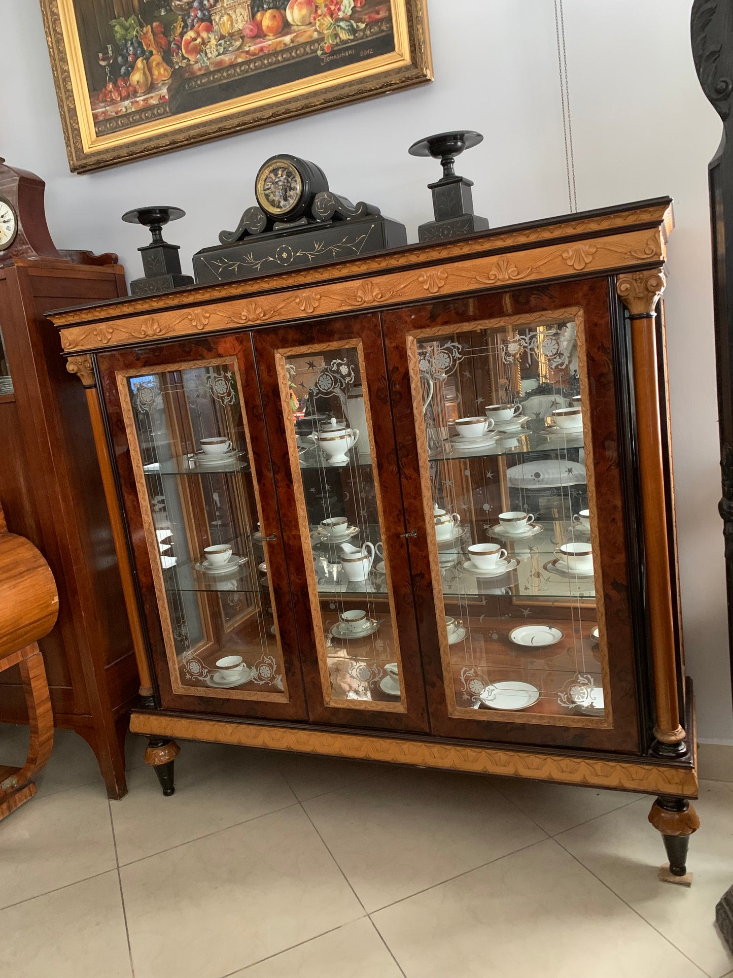 Walnut display cabinet in Empire style