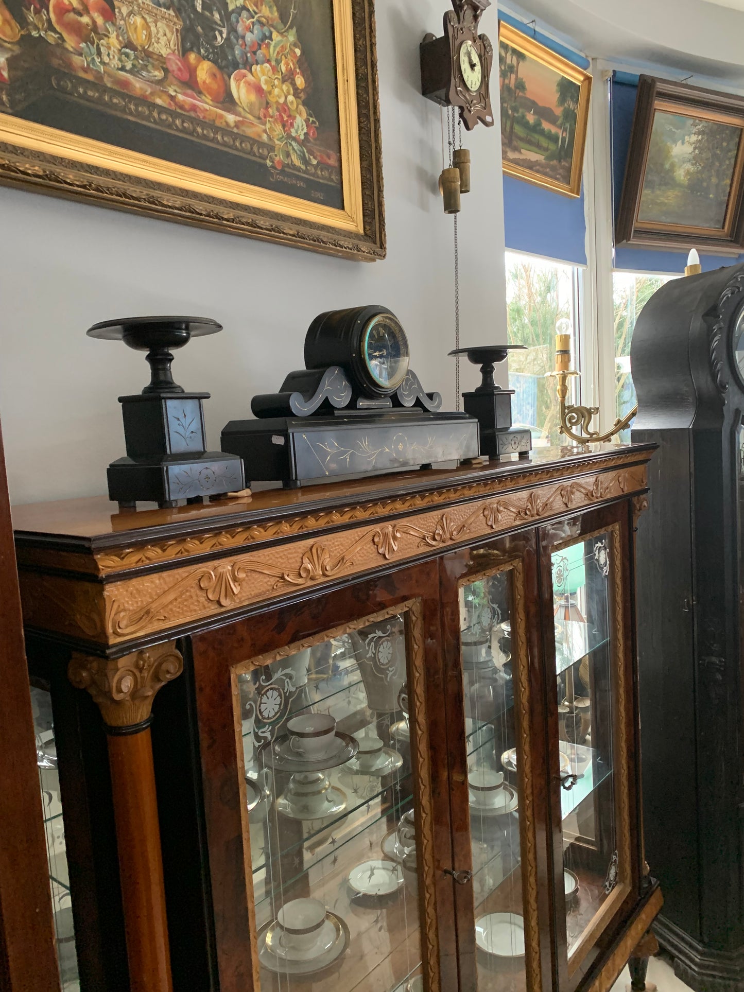 Walnut display cabinet in Empire style