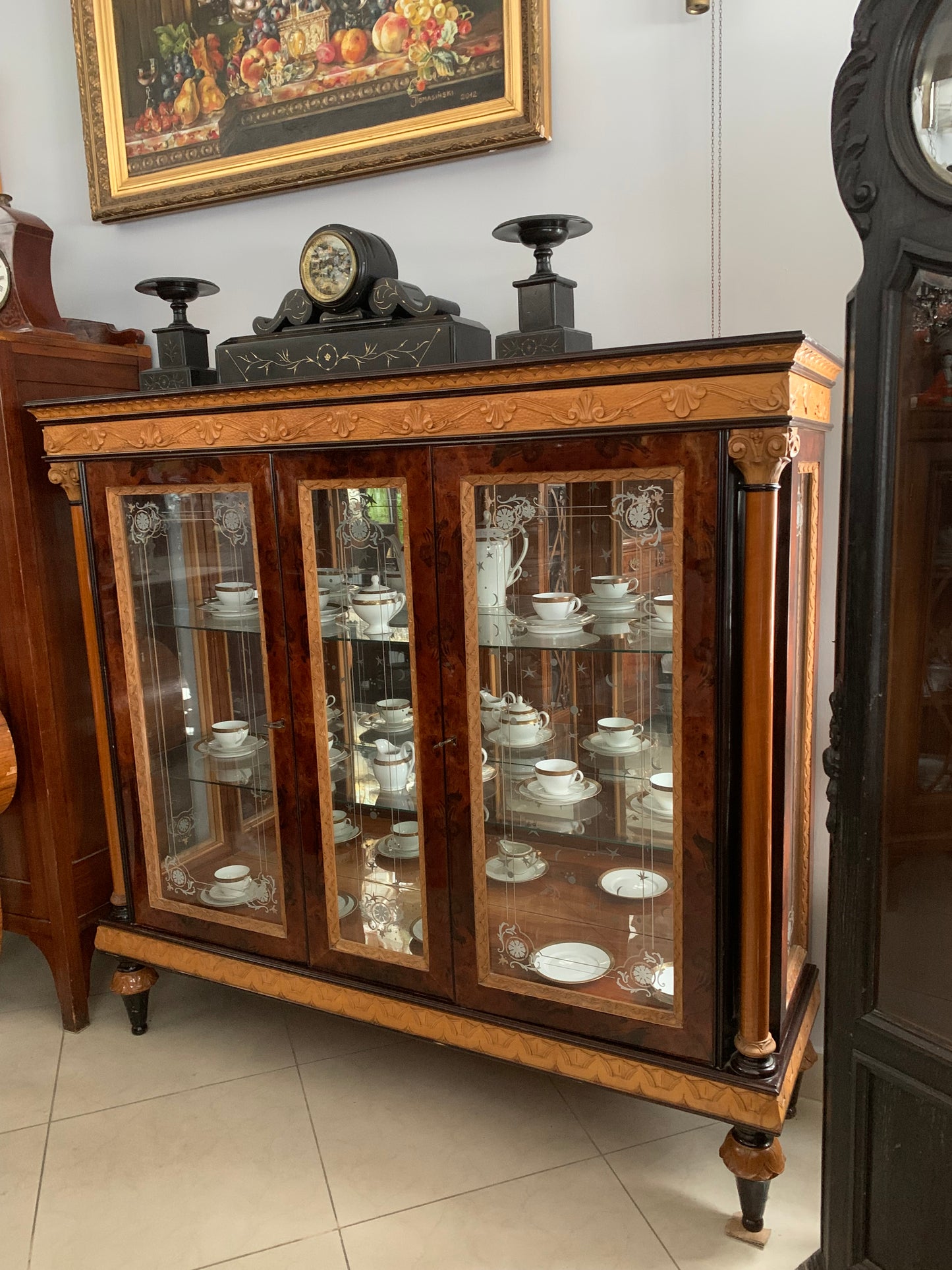 Walnut display cabinet in Empire style