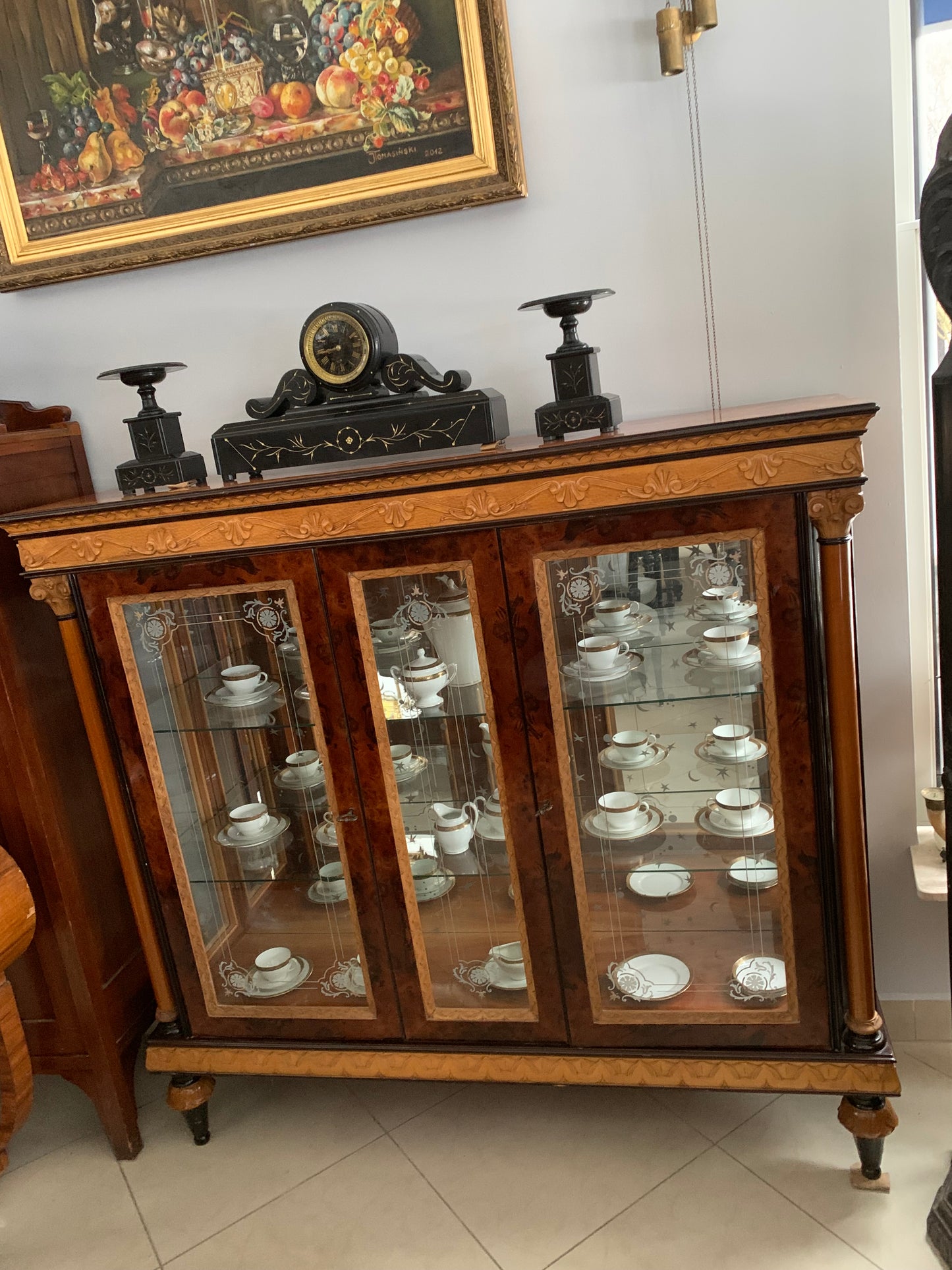 Walnut display cabinet in Empire style