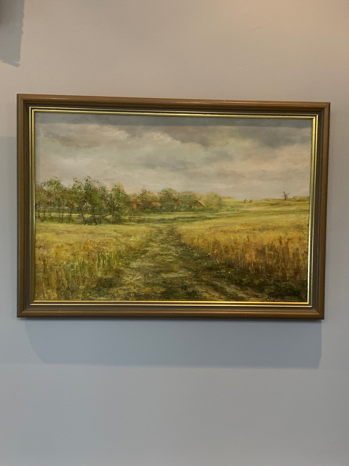 Obraz J. Zgorzałek "Wiejski pejzaż ze stogami i wiatrakiem" 1988 r.