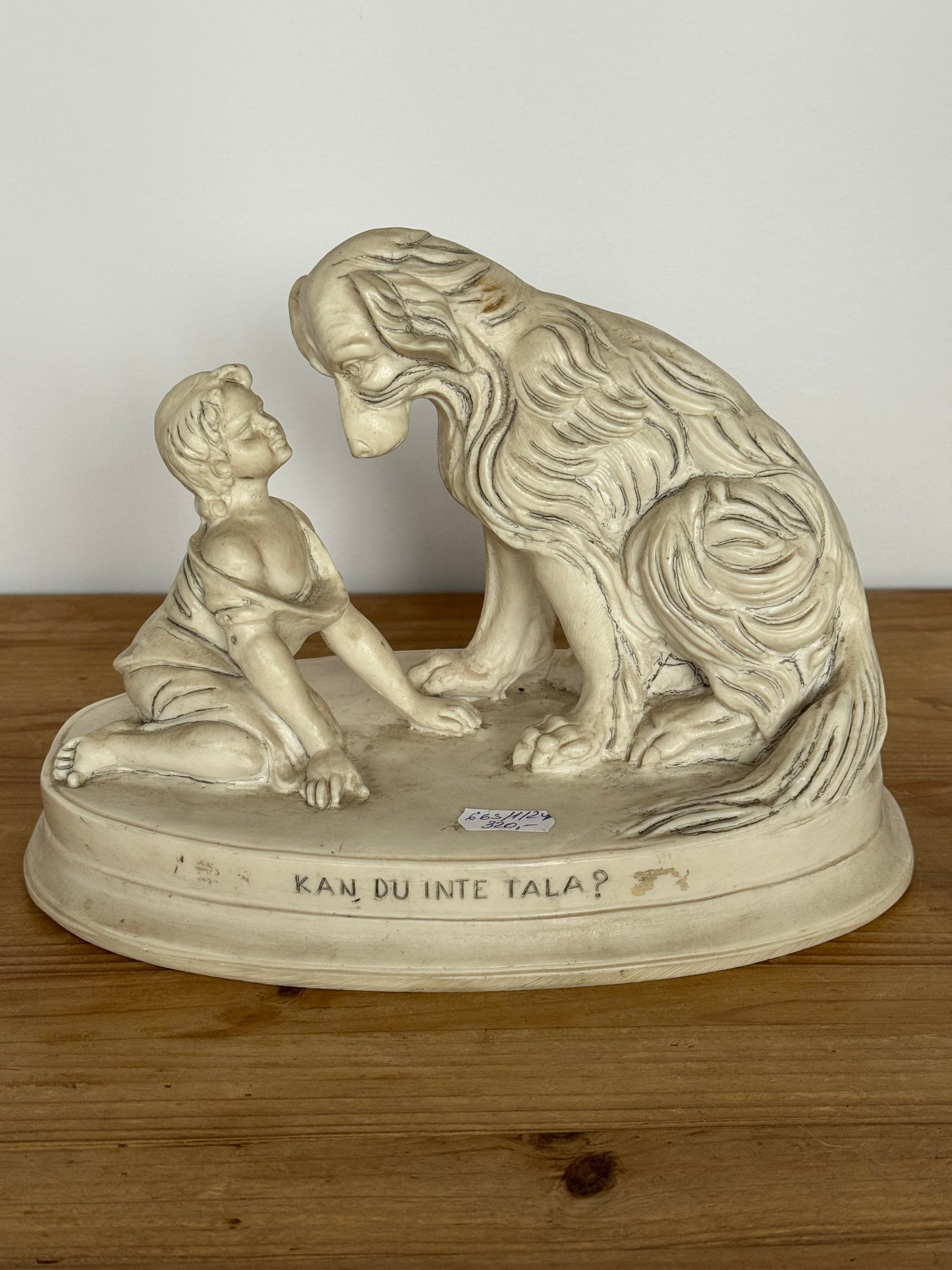 Figurine of a child with a dog, marble