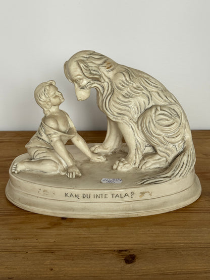 Figurine of a child with a dog, marble