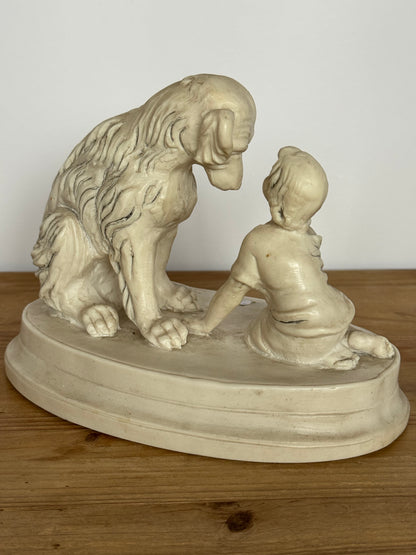 Figurine of a child with a dog, marble